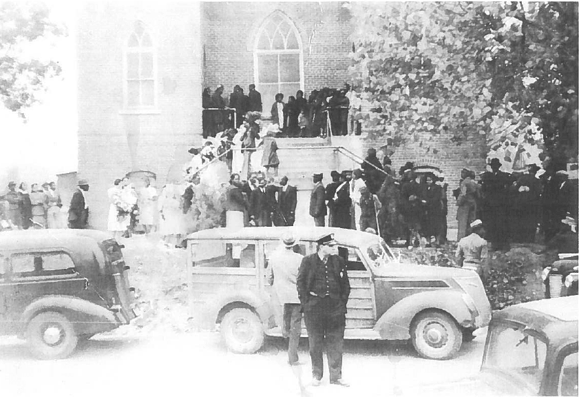 Image of people gathering outside a church